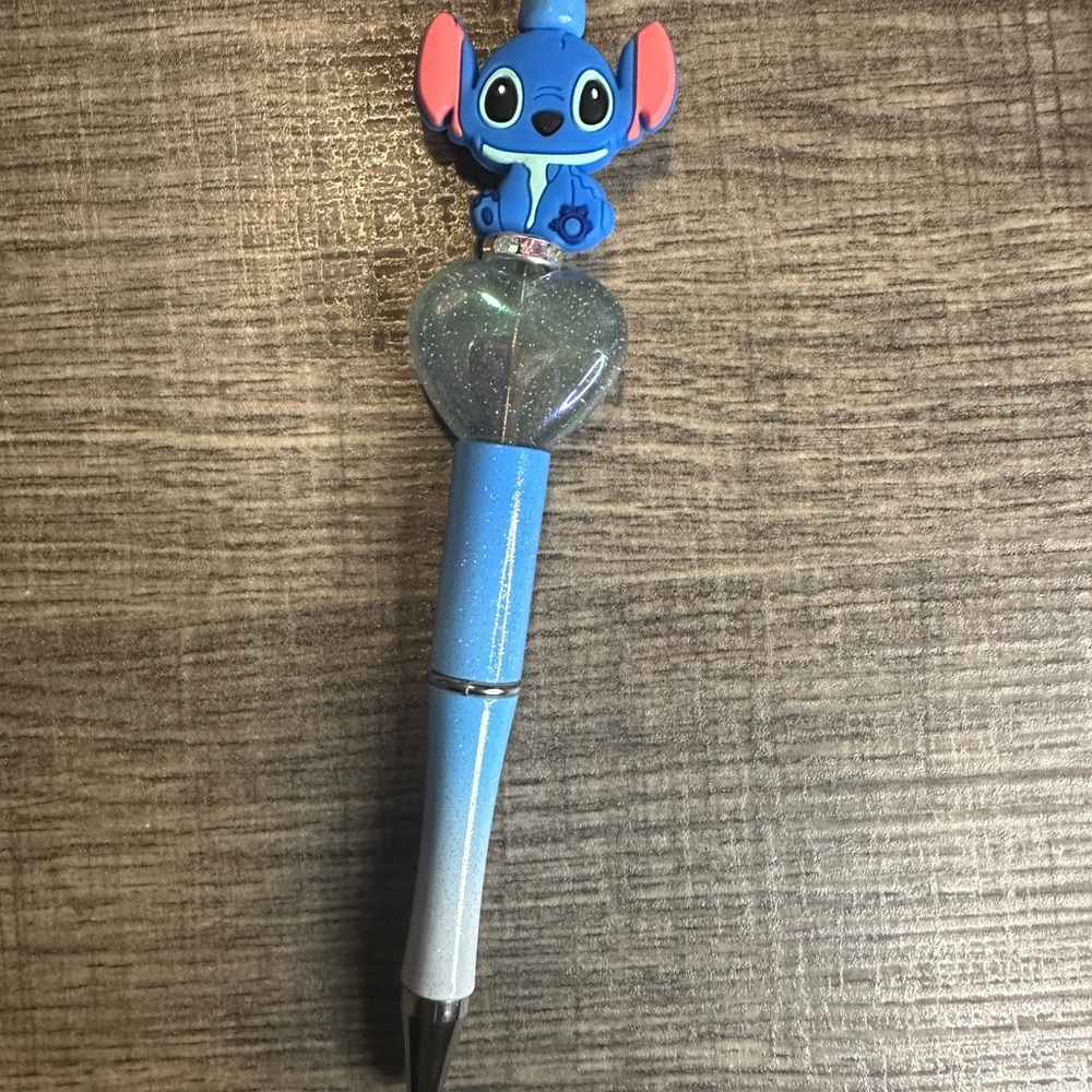 Blue and Black Character Pen